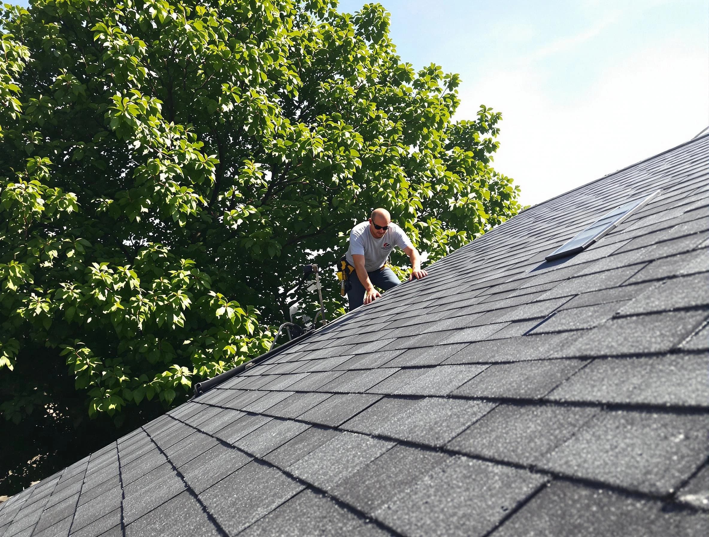 Certified roofers from Shaker Heights Roofing Company working in Shaker Heights, OH